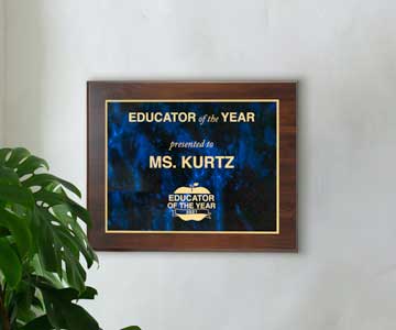 Laser Metal Plaque Hanging on Wall Beside Plant