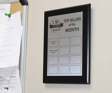 Custom plaque on aluminum board hanging near pinboards in a dentist office.