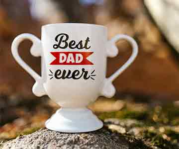 Custom white coffee mug trophy shaped, printed with “Best Dad Ever.”