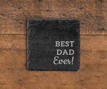 Square granite coaster resting on a wooden desk.