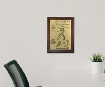 Patent plaque hanging on office wall