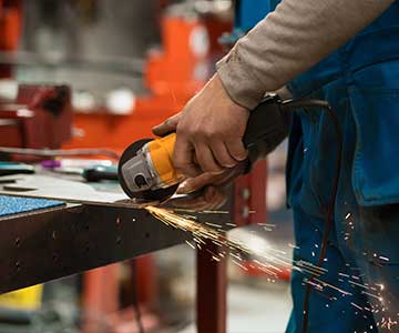 Sparks Flying Off Hand Cut Metal