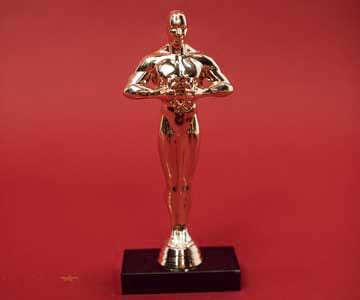 An Oscar award on a red background