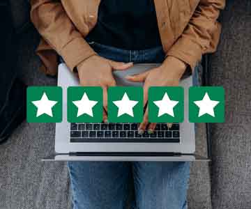 Person on laptop with 5-star blocks overlaid on the picture.