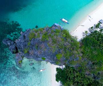 An above shot of a sandy beach in daylight.