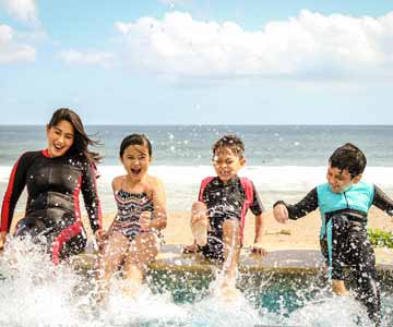 Happy Family Splashing in the Water