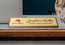 Custom Walnut Desk Wedge With Gold Plate On Desk Next To Cat And Laptop.
