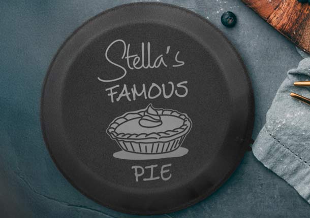 Custom Engraved Black Pie Pan Near Blueberries.