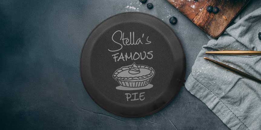 Custom Engraved Black Pie Pan Near Blueberries.