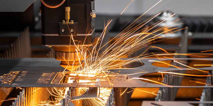 Laser Machine Cutting Through Stainless Steel Metal With Sparks Flying. 