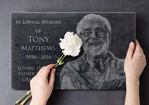 Custom Engraved Granite Headstone With Picture Held By Woman With White Rose