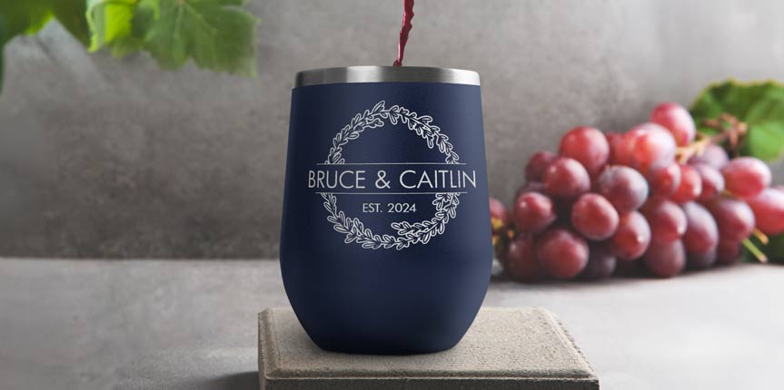 Custom Engraved Navy Blue Wine Tumbler Near Grapes.