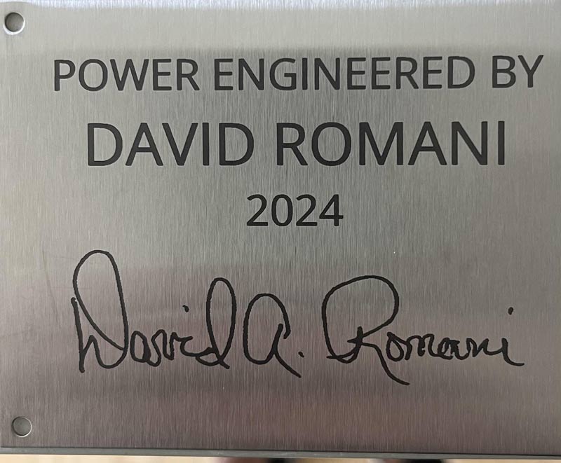 Metal plaque with 'Power Engineered by David Romani 2024' text and signature.