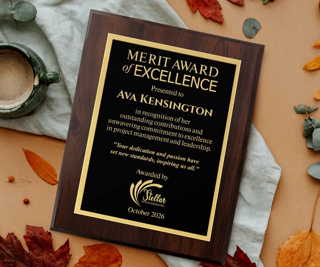Custom Laser Engraved Aluminum Plaque To Ava Kensington On A Table With Leaves and Coffee. 