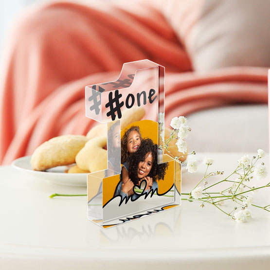 Number One Shaped Acrylic Award For Number One Mom And Printed With Photo Of Mom And Daughter On A Coffee Table With Pastries