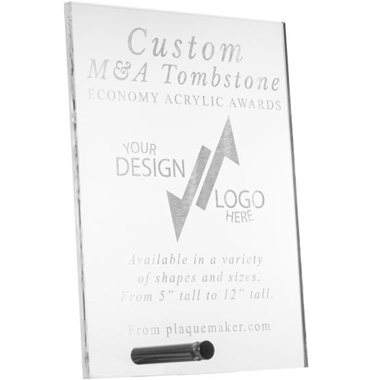 A clear acrylic custom m and a tombstone award, shown at an angle on a white background with engraved text and placeholder artwork with a silver pin for mounting at the bottom.