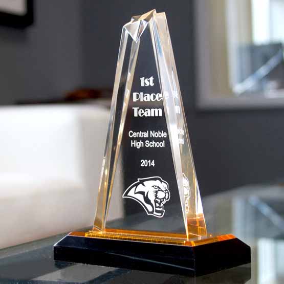 Custom Star Tower Acrylic Award For High School Team With Gold Mirror Base On Work Desk Near Office Window