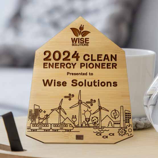 Custom Engraved Bamboo Economy Award in Diamond Shape with your Text and Logo on a Side Table near flowers.