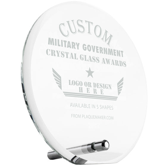 A custom clear glass award with a silver pin at the bottom for mounting, with personalized engraved text and placeholder artwork, set at a slight angle and displayed on a white background.