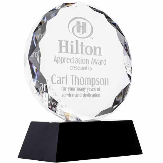 Custom Faceted Circle Glass Award For Appreciation With Hilton Logo And Message And Name Standing Via Black Base 