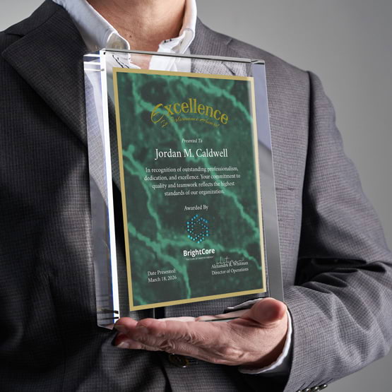Man In Business Suit Holding Rectangle Glass Award With Green Screen Printed With Excellent Performance Message And Logo