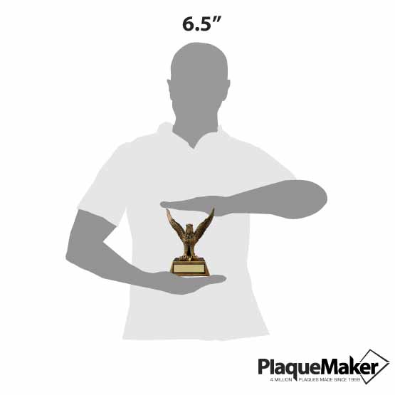 Size Guide With Blank Figure Holding Custom Gold Resin Eagle Trophy Standing Via Resin Base Featuring A Metal Plate