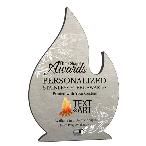 A flame-shaped personalized stainless steel award on a plain white background. The award features printed on white swirl pattern, custom black text, and a small silver mounting pin at the bottom center.