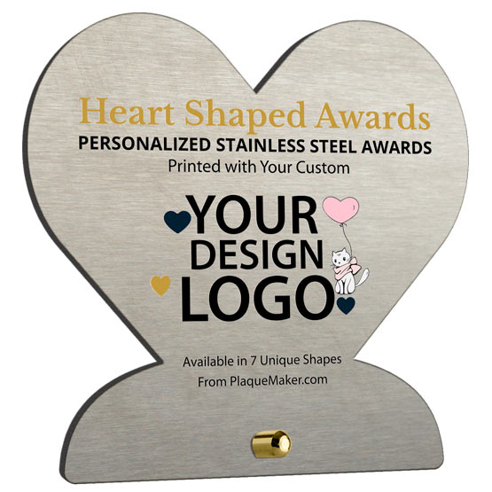 Heart-shaped stainless steel award metal with printed customizable text and artwork and a small gold pin for mounting at the base, shown on a white background.