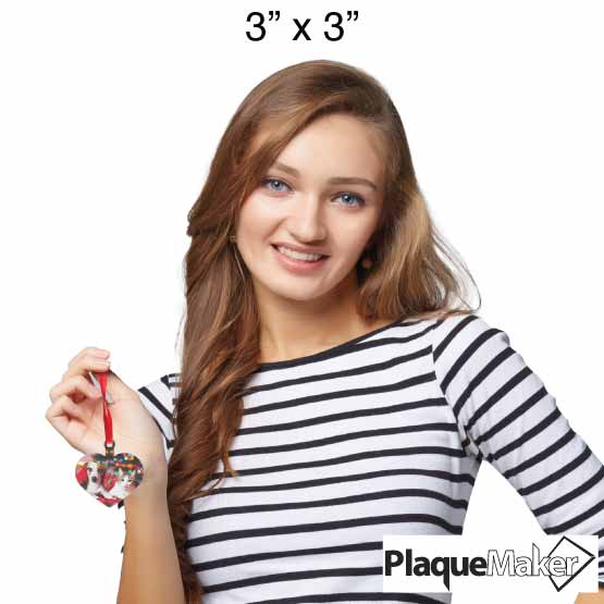 Size Guide With Woman Holding Up Custom Heart Shaped Acrylic Ornament With Red Ribbon And Full Color Photo Of Dog And Cat