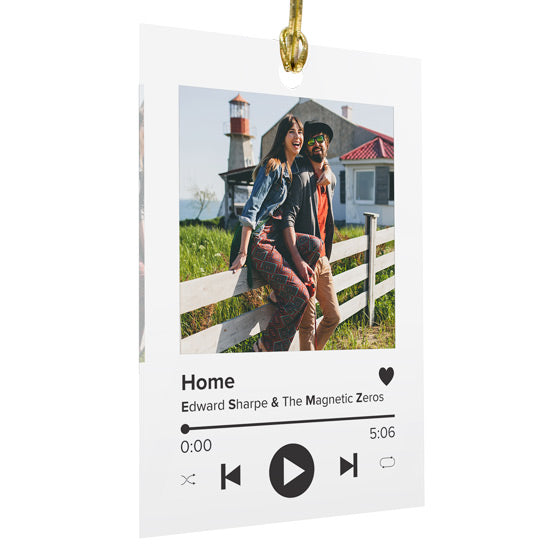 A personalized music player style acrylic hanging ornament featuring a printed photo, a song title, the artist, and the length of the song, shown on a white background.