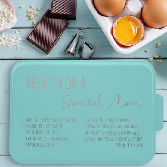 Custom Aluminum Cake Pan With Teal Lid Featuring Recipe For A Special Mom Message On Blue Picnic Table With Eggs