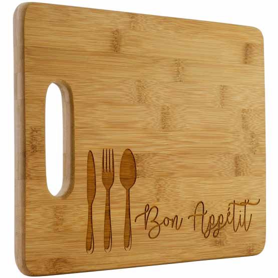 Custom Bamboo Cutting Board With Laser Engraved Artwork Of Utensils And Bon Appetit Text Against White Background
