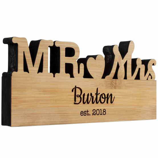 Custom Freestanding Bamboo Sign With Mister And Missus Cutout And Family Name And Established Date Against White Background