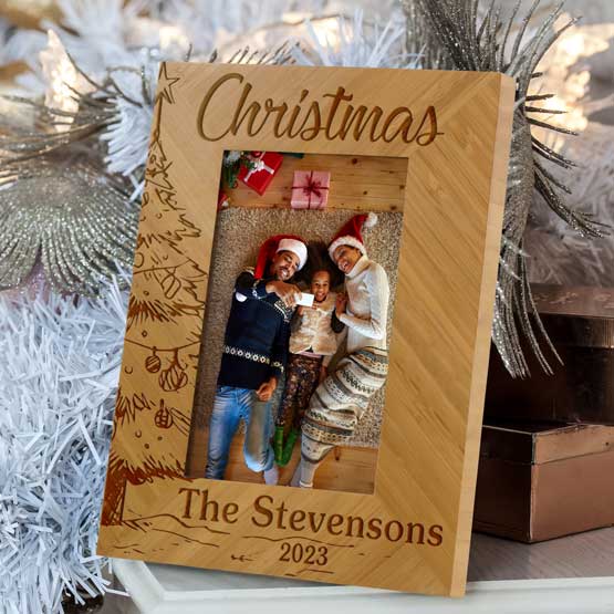 Custom Bamboo Picture Frame With Photo Of Family Near Christmas Tree And Engraved With Christmas Text And Tree And Name