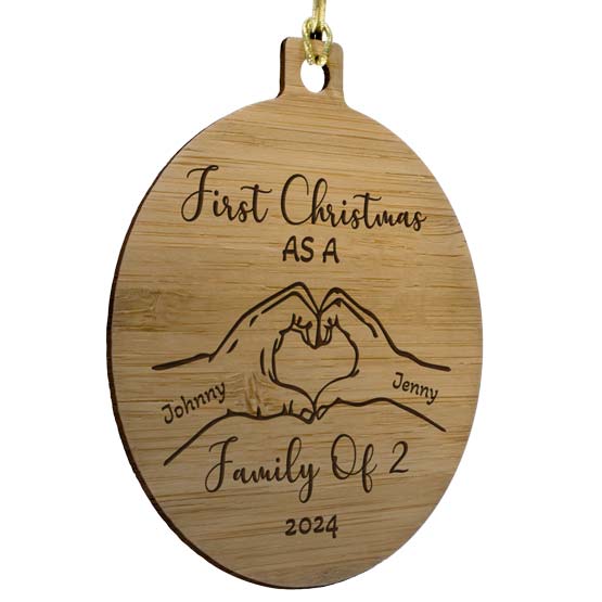 Custom Circle Bamboo Ornament With Gold String And First Christmas Text And Hands Making Heart Artwork And Family Names