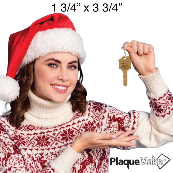 Size Guide With Festive Woman Holding Custom House And Key Shaped Bamboo Ornament Engraved With First Christmas Text