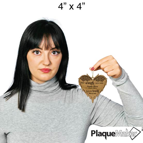 Size Guide With Woman Holding Custom Heart Shaped Bamboo Ornament Engraved With Angel Wing Art And Memorial Message