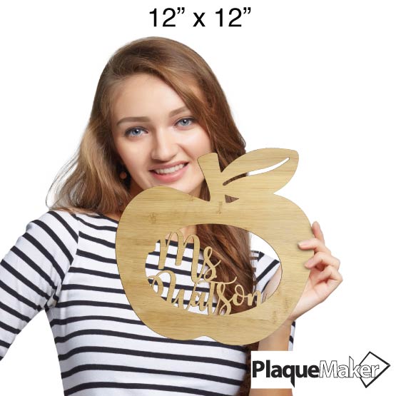 Size Guide With Happy Woman Holding Custom Apple Shaped Bamboo Sign With Teacher Name Inside Oval Cutout 