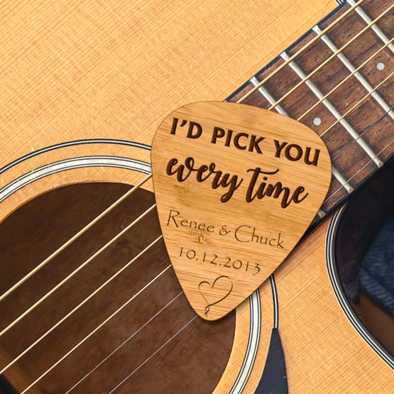 Custom Bamboo Sign With Guitar Pick Shape And Engraved With Names And Date And I’d Pick You Every Time Resting On A Guitar