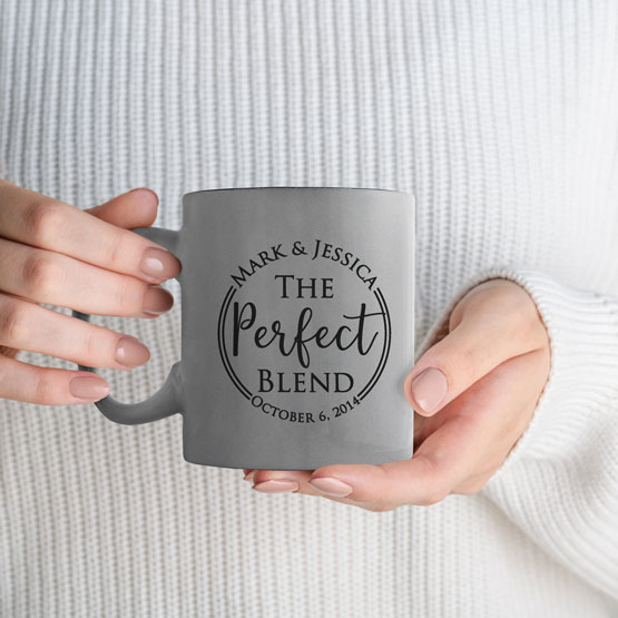 Woman Hands Holding Custom Silver Coffee Mug Laser Engraved With Couple Names And The Perfect Blend Text And Date