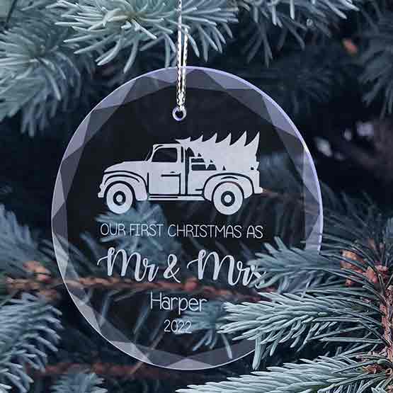 Custom Circle Glass Ornament Engraved With Truck Carrying Tree Art And Our First Christmas Message Hanging On Christmas Tree