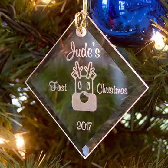 Custom Diamond Shaped Glass Ornament Engraved With Jude’s First Christmas And Date And Reindeer Art Hanging On Christmas Tree