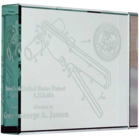 Custom Glass Paperweight Engraved With Patent Image And Details And Seal And Name Against A White Background