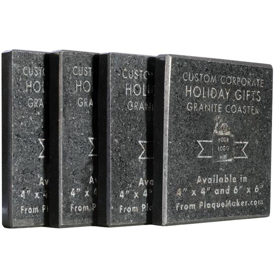 Four black granite coasters shown in a row on a white background, with engraved text reading about the details of the coaster and a sample logo.