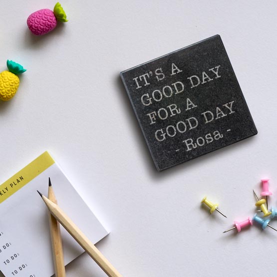 Custom Square Granite Coaster Engraved With Name And It’s A Good Day For A Good Day Text On Work Desk With Office Supplies