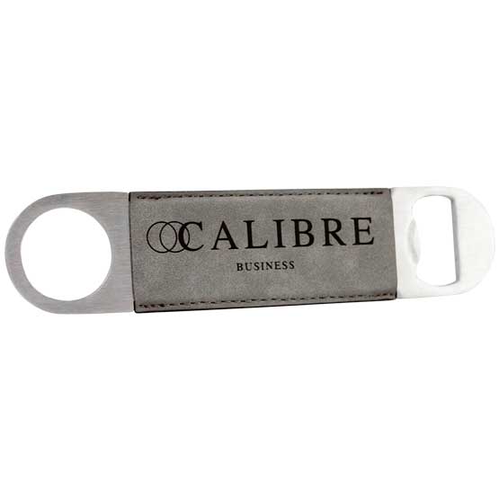 Custom Stainless Steel And Gray Faux Leather Bottle Opener Laser Engraved With Calibre Business Logo Against White Background