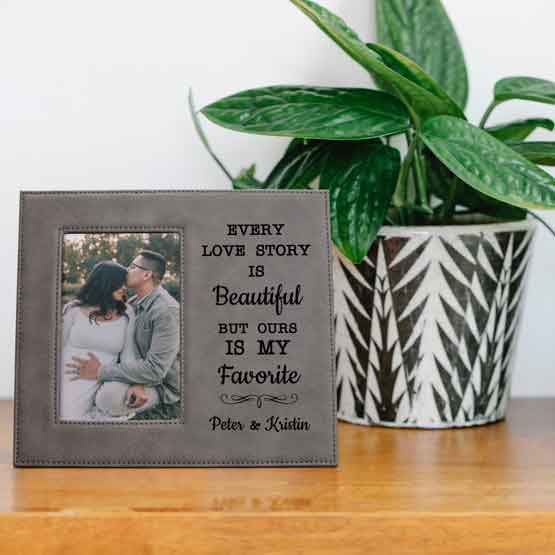 Custom Gray Faux Leather Picture Frame With Couple Photo And Love Story Message On Wood Shelf With Potted Plant