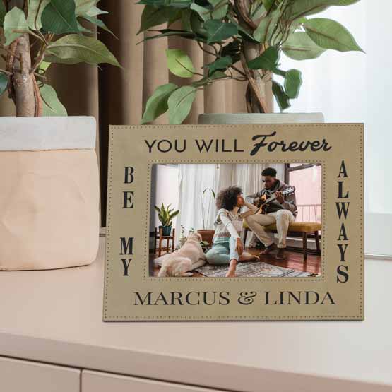 Custom Light Brown Faux Leather Picture Frame With Couple Photo And Romantic Quote On Dresser With Two Potted Plants