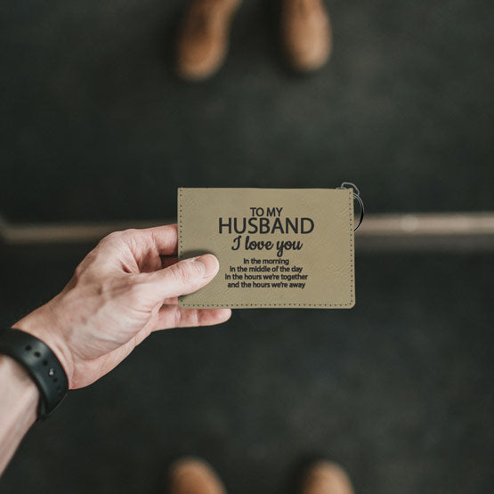 Man Hand Holding Custom Light Brown Faux Leather Keychain Wallet Laser Engraved With Husband Appreciation Message