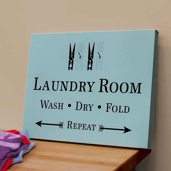 Teal Faux Leather Wrapped Rectangle Canvas Engraved With Clothespin Art And Laundry Room Text On Shelf With Clothes